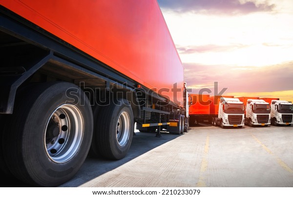 Semi TrailerTrucks on Parking with The\
Sunset Sky. Truck Wheels Tires. Shipping Container. Delivery\
Transit. Diesel Trucks. Lorry Tractor. Industry Freight Trucks\
Logistics Cargo\
Transport.	\
