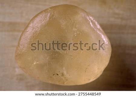 SEMI TRANSLUCENT NUGGET WITH VERY SMOOTH SURFACE AND WAXY LUSTRE