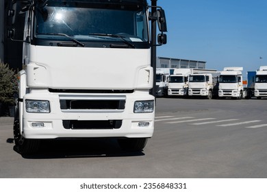 Semi truck fleet at the logistics center. - Shutterstock ID 2356848331
