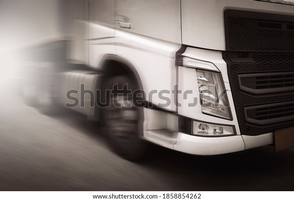 Semi truck motion speeding on road.\
Industry cargo business. Logistics freight\
truck.