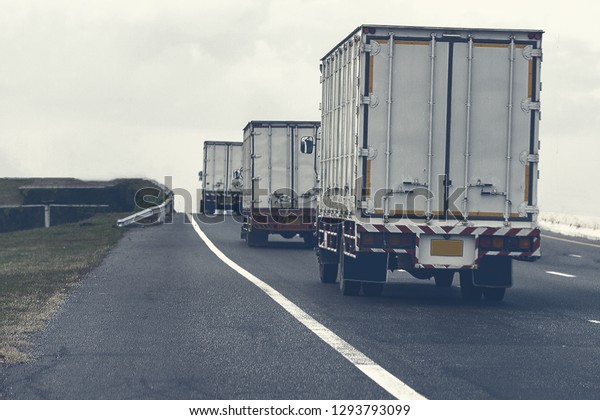 Semi Truck on highway road with container,\
transportation concept.,import,export logistic industrial\
Transporting Land transport on the asphalt expressway.motion\
blurred to soft focus