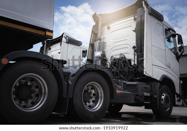 Semi truck parking at the warehouse. Industry\
cargo freight truck transport. Big truck tires. Trucking cargo\
transportaion. Economy\
logistics.