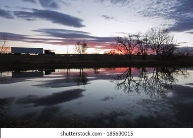 Semi Truck Seen During Sunset - Reflected In The Pond