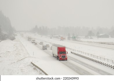 Semi Truck Traffic On Interstate 5 During A Winter Snow And Freezing Rain Storm