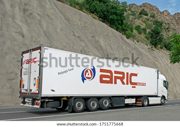 Semi truck transporting goods and food, belonging to\
the transport company \