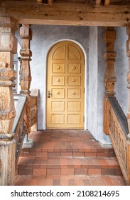 Semicircular Wooden Door In The Entrance Building And Stone Porch With Steps