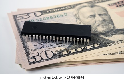 Semiconductor Chips Shortage. Concept. Large Computer Chip Placed On Stack Of 50 Dollar Banknotes. High Price And Global Shortage Of Microchips.