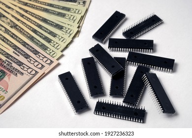 Semiconductor Chips Shortage And High Price. Pile Of Computer Chips And Spreadof  US Dollars. Concept For Crisis In The Industry.