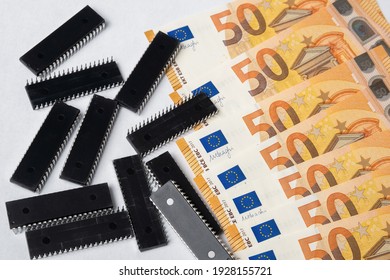 Semiconductor Chips Shortage And High Price. Pile Of Computer Chips And Spread Of Euro Banknotes. Concept For Crisis And Deficit In The Electronic Industry In EUROPE. 