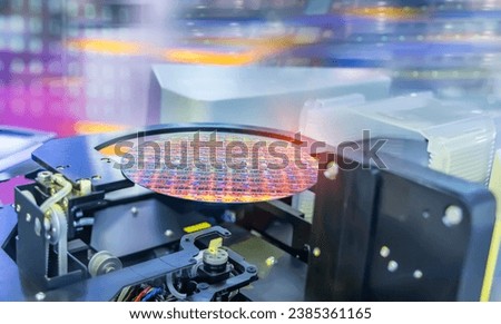 Semiconductor and Computer Chip Manufacturing at Fab or Foundry with robotic arms with silicon wafers 