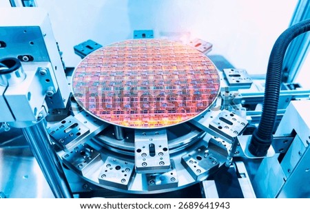 Semiconductor and Computer Chip Manufacturing at Fab or Foundry with robotic arms with silicon wafers 