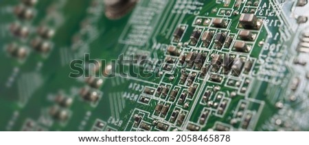 Semiconductor. cpu chip located on the green motherboard of the computer. Semi conductor motherboard circuit board. Hightech computer board with manufacture chip pcb technology. Smart phone iot chip.