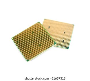 Semiconductor innovation: two intricate microprocessor components showcase sophisticated engineering with striking metallic surfaces and golden pin grids. Vibrant green substrates contrast sharply against lustrous gold connectors, emphasizing electronic complexity and precision manufacturing. Square-shaped silicon devices positioned with depth perspective highlight technological advancement in microelectronics fabrication. Softly blurred surroundings suggest sterile high-tech habitat while maintaining focus on circuitry patterns and sophisticated design elements. This visual depiction captures essence of modern computing, hardware imagery, and futuristic industrial innovation for technology marketing. Graphical imaging with microscopic detail portrays reliability in semiconductor industry and digital component manufacturing, ideal for tech company promotions.