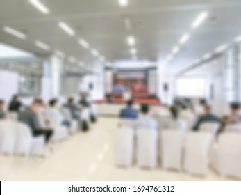 Seminar Conference Blurred Background With Audience And Speaker Presentation Or Blurry Townhall Meeting