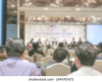 Seminar Conference Blurred Background With Audience And Speaker Presentation Or Blurry Townhall Meeting