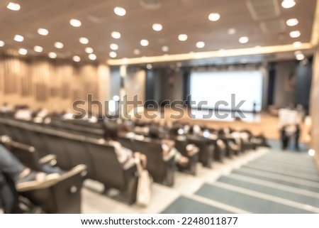 Seminar conference or town hall meeting blur background in auditorium or hotel room with audiences, speaker podium stage and presentation screen for entrepreneurship business speech or community talk