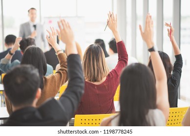 Seminar Group Raising Up Hand For Asking The Speaker In Question And Answer Time In Meeting Room Back Side