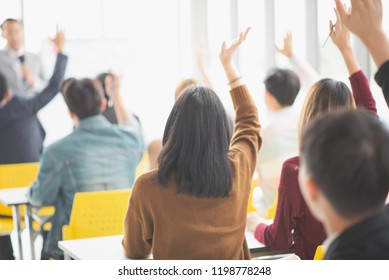 Seminar Group Raising Up Hand For Asking The Speaker In Question And Answer Time In Meeting Room Back Side