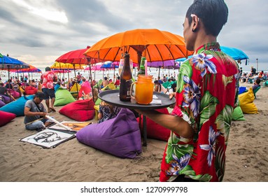Seminyak, Bali, Indonesia : Tourist enjoying colourful Seminyak Beach, a popular tourist destination in famous Bali Island (11/2017).