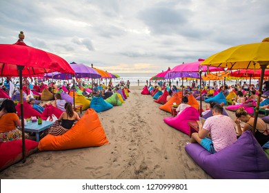 Seminyak, Bali, Indonesia : Tourist enjoying colourful Seminyak Beach, a popular tourist destination in famous Bali Island (11/2017).