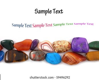 Semi-precious stones against white background with room for text