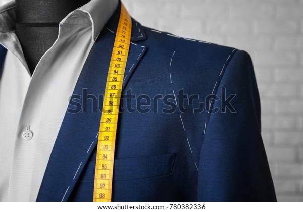 Semi-ready suit on\
mannequin indoors,\
closeup