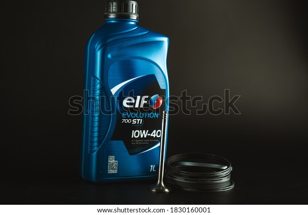 semi-synthetic engine oil\
Elf 10w-40. Motor oil elf on dark background. Advertising brochure\
concept