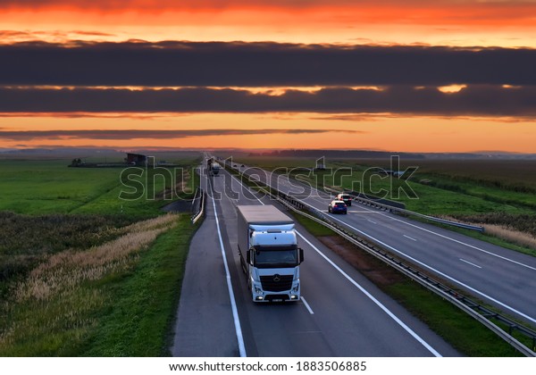 Semi-trailer Truck\
Mercedes-Benz Actros driving on highway on sunset background. The\
concept of transport logistics and transportation of goods and\
cargo RUSSIA, MOSCOW - SEPT 12,\
2020\
