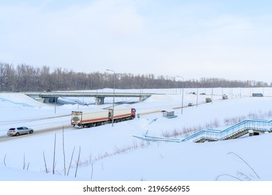 A Semi-trailer Truck, Semitruck, Tractor Unit And Semi-trailer To Carry Freight. Cargo Transportation In Harsh Winter Conditions On Slippery, Icy And Snowy Roads.