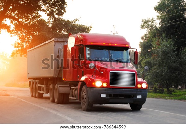 Semi-trailer truck in\
sunset