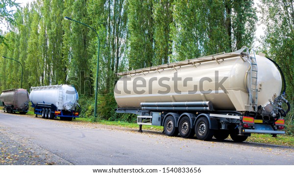 Semi-trailers of bulk tank . Truck\
big cistern . Modern semi-trailers for freight transport . Dry\
cargo 