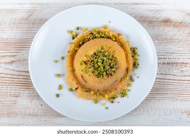 Semolina Halva with Pistachios. Traditional Turkish semolina sweet desert halva (Turkish name; irmik helvasi).