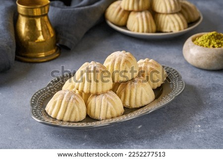 Semolina maamoul or mamoul cookies with dates , walnuts and pistachio nuts. Traditional arabic Eid al Adha, Eid al Fitr sweets                               