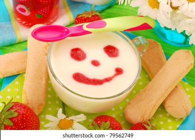 Semolina Porridge With Strawberry Sauce  And Lady Fingers Cookies As Dessert For Baby