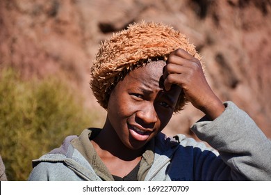 Semonkong, Kingdom of Lesotho, Africa – 26th of July 2019: young boy from Basotho people, traditionally dressed with tribal blankets.