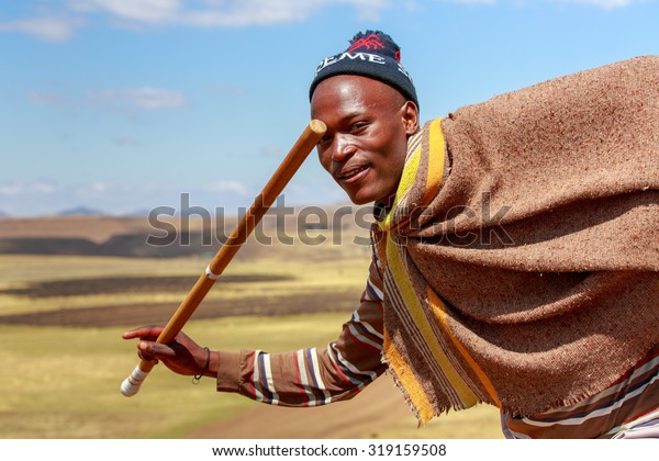 Group of young Basotho men wearing traditional Basotho 