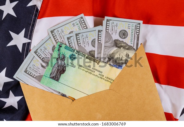 Senate stimulus deal includes\
individual checks virus economic stimulus plan USA dollar cash\
banknote on American flag Global pandemic Covid 19\
lockdown