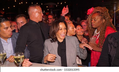 Senator Kamala Harris Presidential Candidate laughing￼￼ at the world-famous gay bar the Abbey in West Hollywood October 2019. election 2020 taking photos with her constituents in Los Angeles
