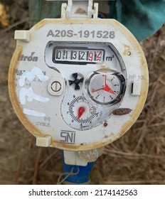 Sendawar City, Indonesia.  1 july 2022. The water meter shows the number of water usage, Measuring device, Open the cover of the water meter to check the amount of water consumption counter.