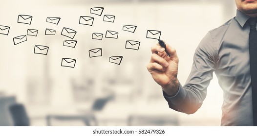 Sending Email Concept - Businessman Drawing Envelopes In Office