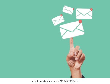 Sending email contact network concept. Hands finger touch pointing email contact icons green background, communication message send and receive. - Powered by Shutterstock