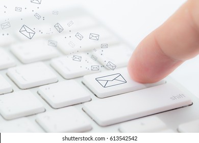 Sending Email. Gesture Of Finger Pressing Send Button On A Computer Keyboard - Selective Focus.