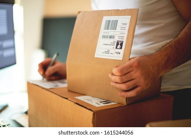 Sending Packages, working in post office - Shutterstock ID 1615244056