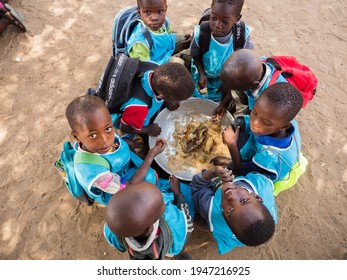 Senegal, Africa - Jan 2019: Senegalese Children Eat At School Together In A Traditional Way.