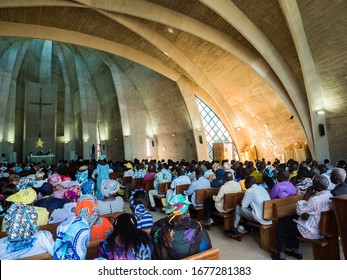 Senegal, Africa - January 2019: African People In Colorful Clothes (boubou) During A Mass At A Catholic Church In West Africa