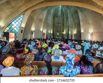 Senegal, Africa - January 2019: African people in colorful clothes (boubou) during a mass at a Catholic church in West Africa