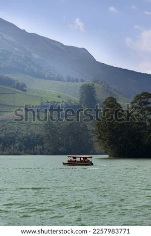 
Senic view of foggy mountains and low level clouds in the winter early morning at Mattupetty lake Munnar, Kerala, India - low visibility 