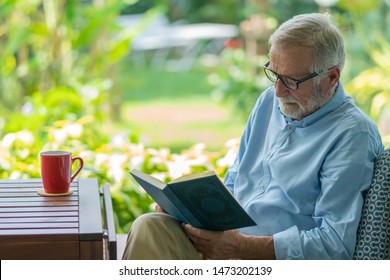 Senioe man reading a book at home -Image - Powered by Shutterstock