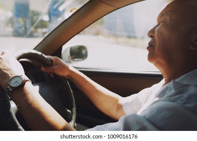 Senior 65-70 Years Man Driving Car