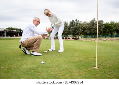 Senior active people having fun at the golf course and enjoying free time outdoors. - Powered by Shutterstock